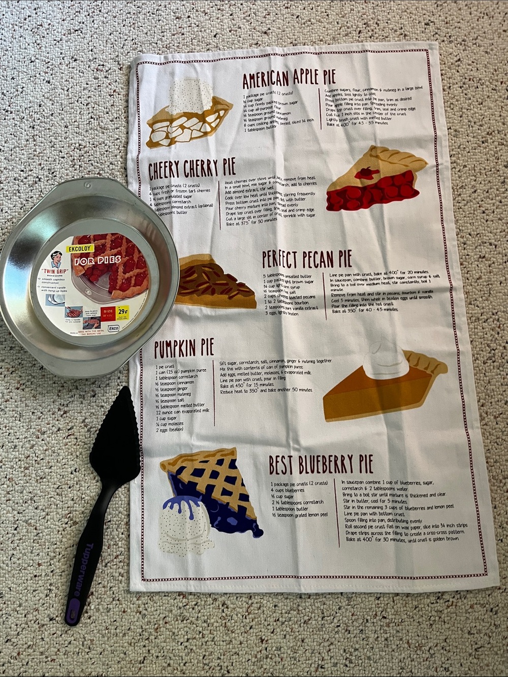 Ecology Non-Stick Silver Pie Pan with Black Pie Server and White Recipe Towel